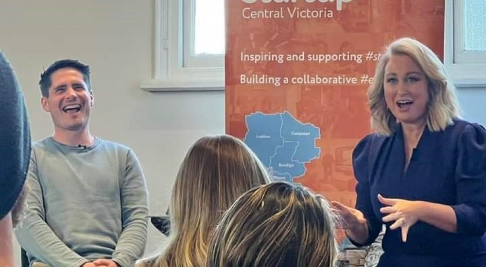 Jane Bunn entertaining Caleb Maxwell and the audience with a funny side of her startup journey.