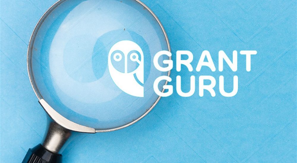 grant-guru-logo-overlapping-a-magnifying-glass